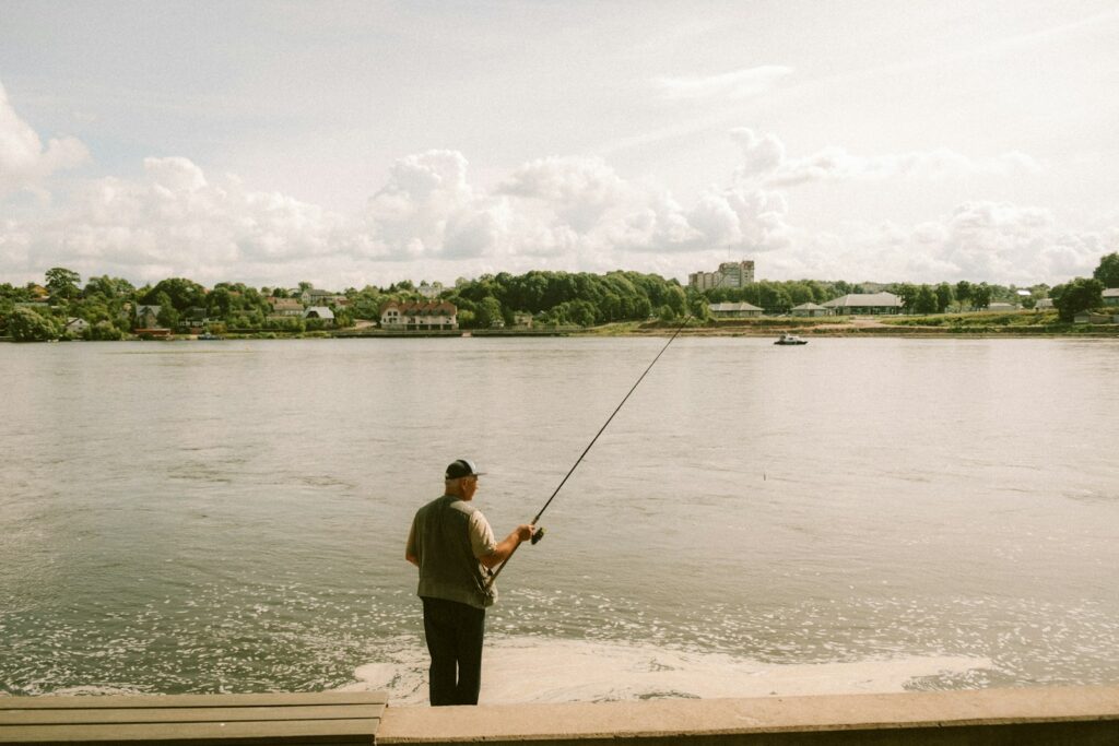 Largemouth bass caught by an angler on a Southeast reservoir with open water and shoreline cover