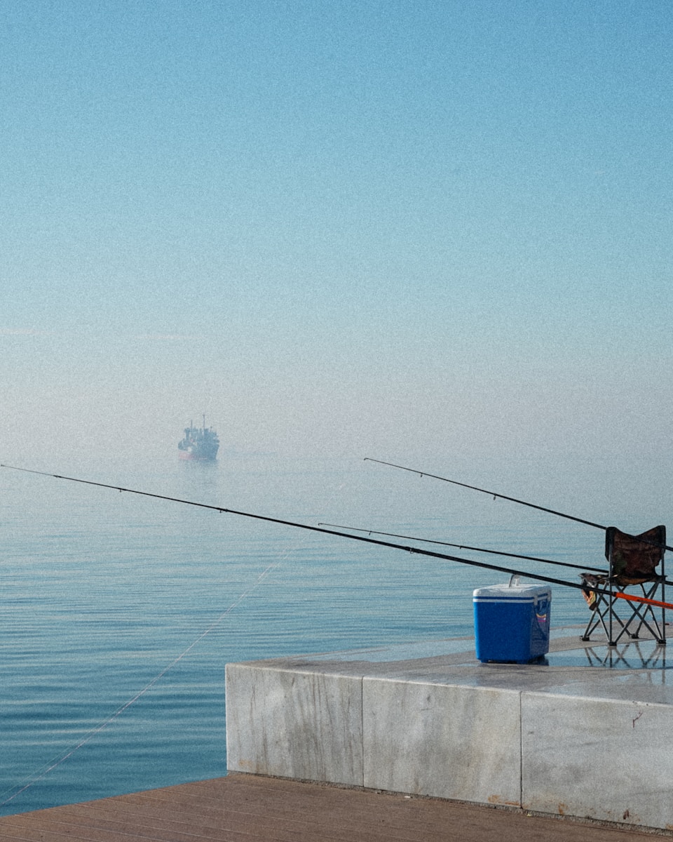 Fishing reel spooled with line ready for inspection and replacement before a fishing trip
