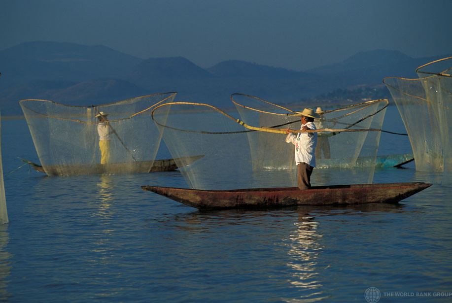 Angler drift fishing from a boat while current carries the rig through open water
