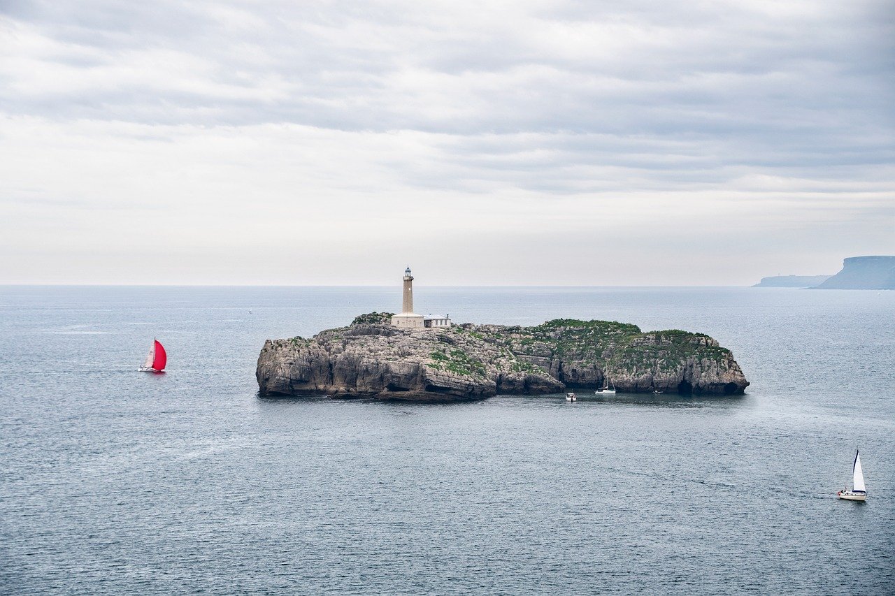 Offshore fishing charter boat running across blue water