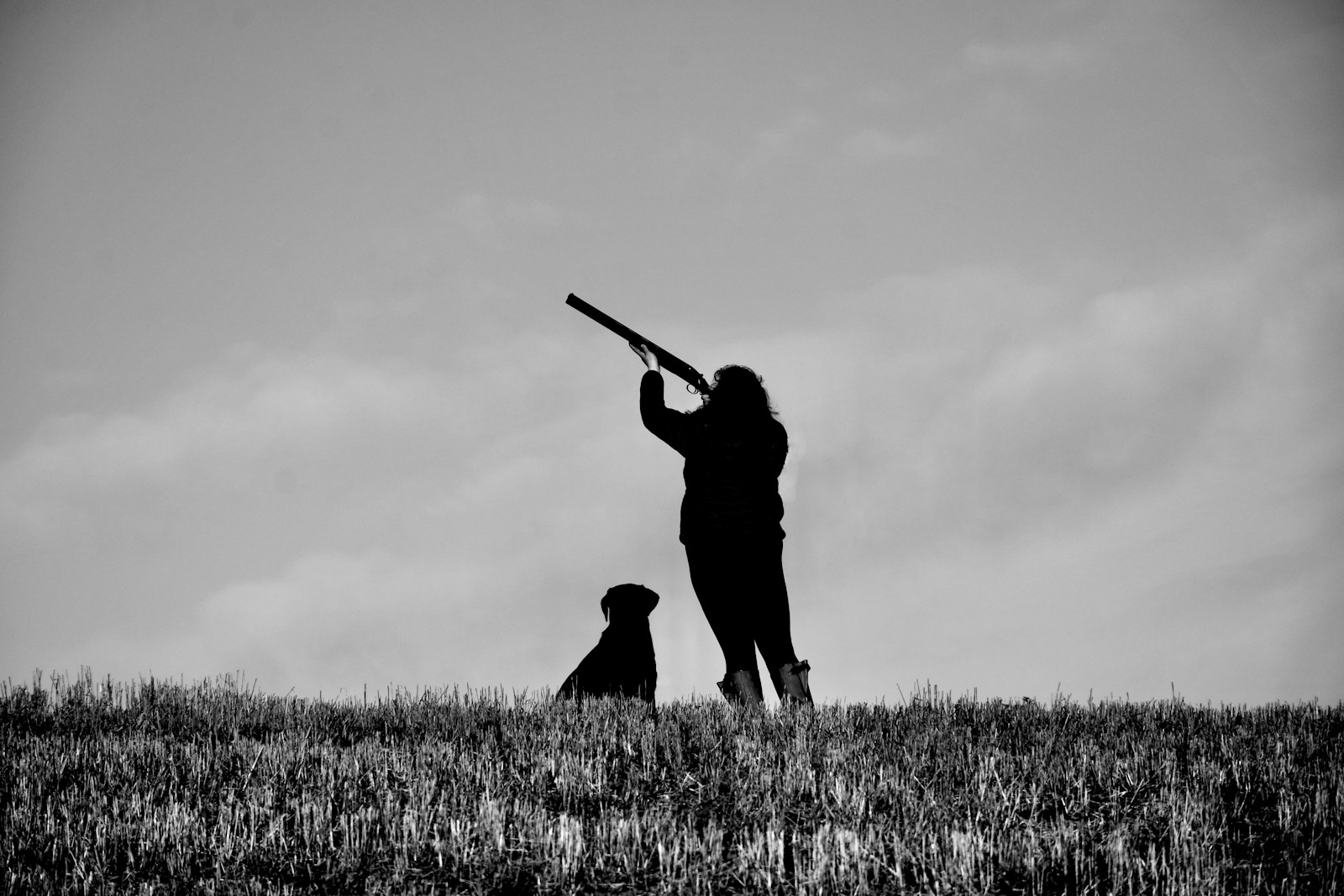 Hunter reviewing firearm and hunting regulations before choosing a legal setup for the season