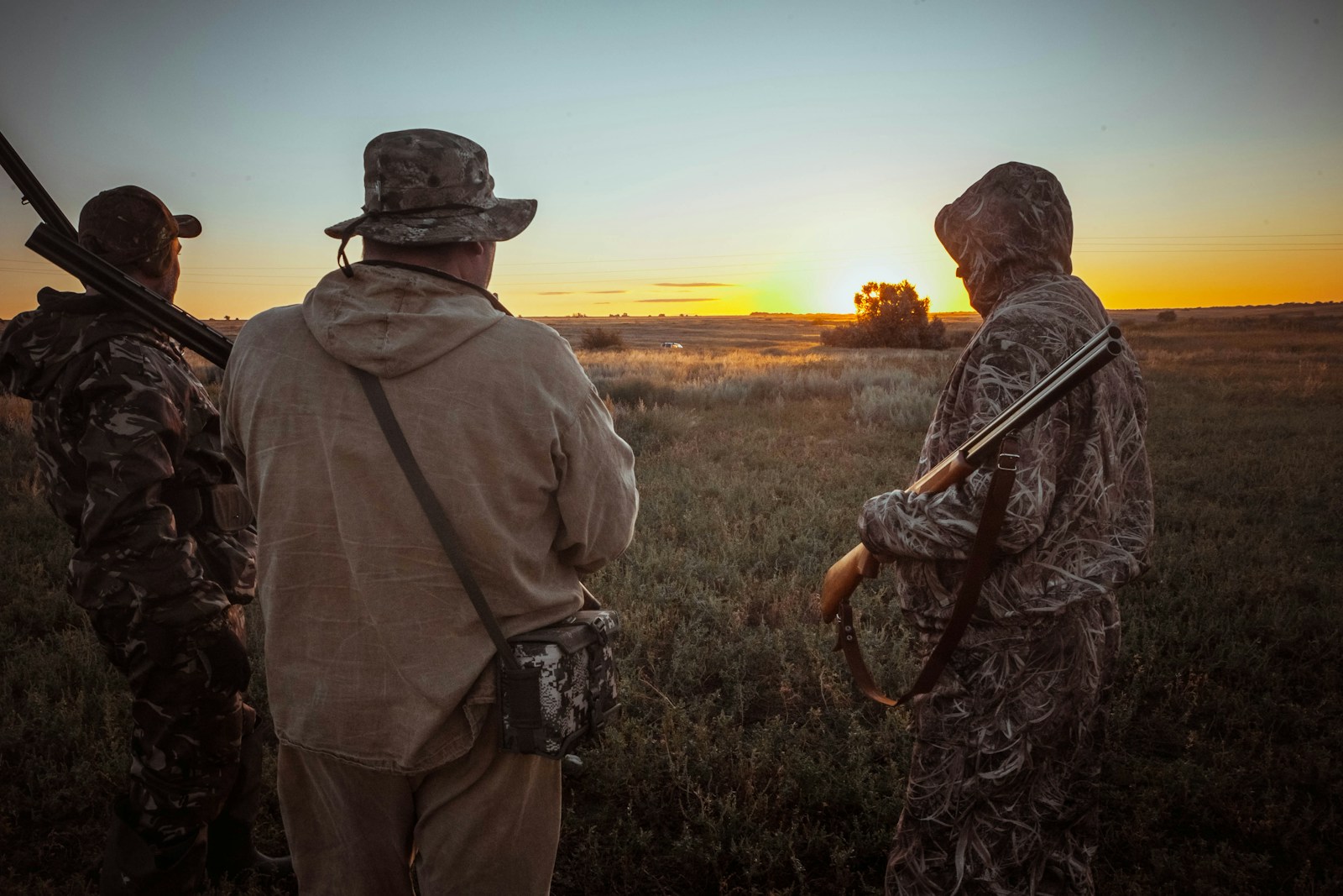 Hunter reviewing current hunting laws and regulations before heading into the field