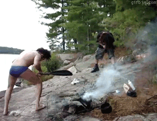Campers enjoying simple outdoor activities together at a wooded campsite
