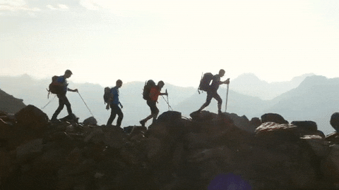 Hiker wearing light layers on a cool 50-degree trail day