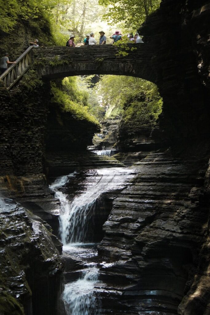 Campers hiking the waterfall gorge near their campsite at Watkins Glen State Park in New York