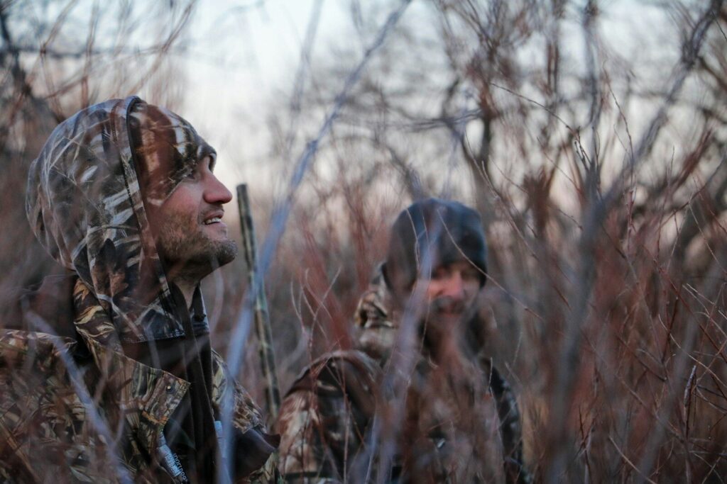Hunter checking license and tag requirements before visiting a sporting goods store