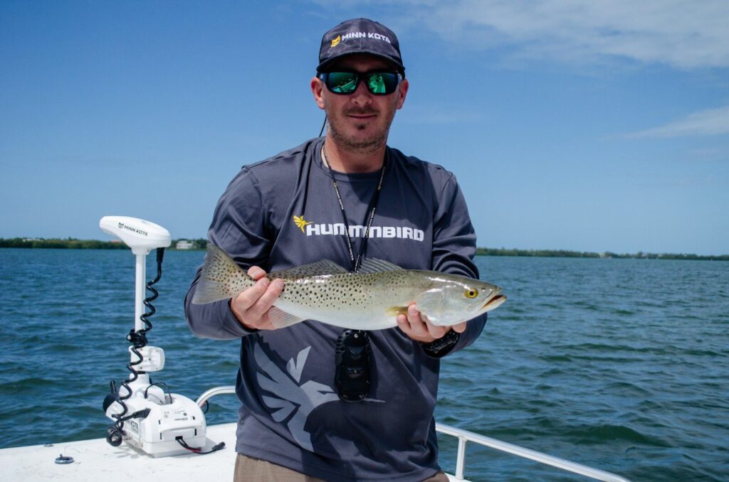 Angler fishing Florida waters during a hot summer morning