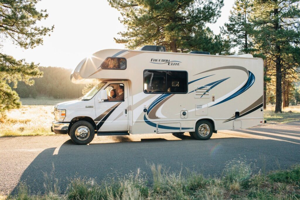 Travel trailer being delivered to a buyer’s home by an RV transport driver