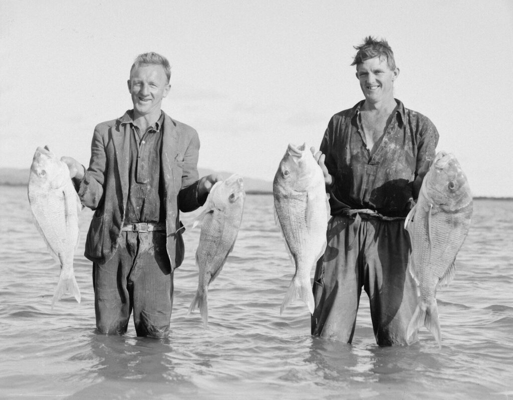 Angler and fishing guide on the water during a guided trip where gratuity is customary