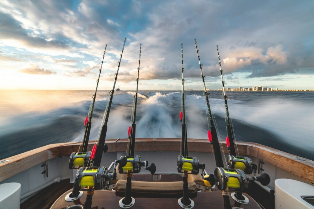 Fishing charter captain operating a boat while preparing for a professional guided trip